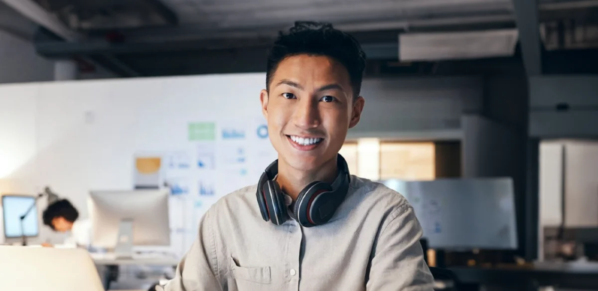 Student wearing a black pair of headphones
